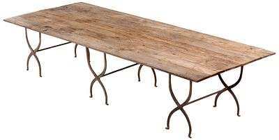 LARGE WINE PARTY TABLE HAVING AN OAK TOP AND THREE FOLDING IRON BASES. MADE TO EASILY DISMANTLE TO. 