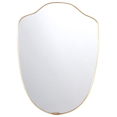 AN ITALIAN MIRROR WITH SHAPED BRASS FRAME CIRCA 1950. An Italian mirror with shaped brass frame 