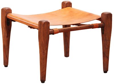 A LEATHER AND WOOD SAFARI STYLE FOOT STOOL IN THE STYLE OF THE DESIGN BY ESBEN KLINT AND PRODUCED BY