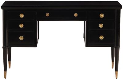 EBONIZED WOOD AND BRASS WRITING DESK C 1950 HAVING SEVEN DRAWERS AND A SLIGHT CURVE TO THE TOP. 