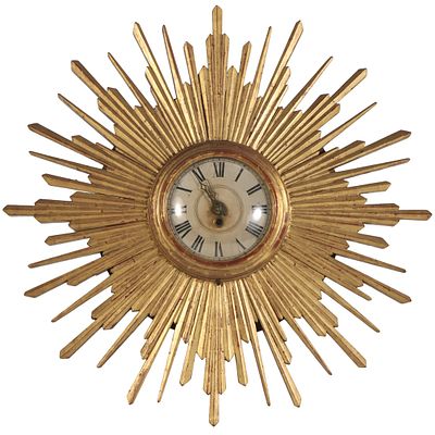 CARVED AND GILTWOOD STARBURST WALL CLOCK C 1950. Carved and giltwood starburst wall clock C 1950 