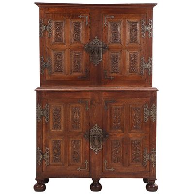 TWO PART OAK CABINET HAVING ELABORATE STEEL HARDWARE AND CARVED PANELS INSIDE AND OUT. MOST. Two 