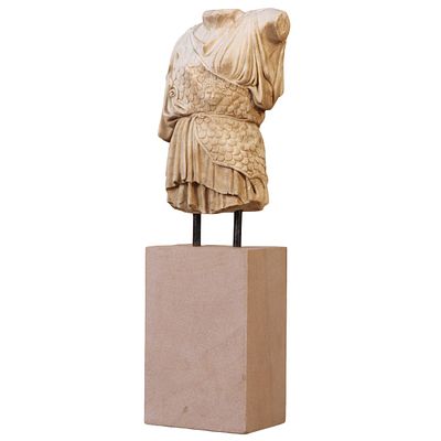 A ROMAN STYLE CARVED MARBLE PARTIAL TORSO MOUNTED TO AN IRON BASE. A Roman style carved marble 