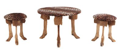 THREE PIECE TABLE AND STOOL SET COMPRISED OF DEER FEET, WOOD AND FAUX LEOPARD FABRIC. Three 