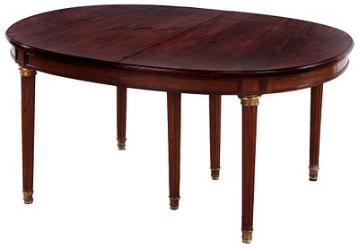 FRENCH MAHOGANY LOUIS XVI STYLE BRONZE MOUNTED DINING TABLE HAVING TWO LEAVES C 1910. French 