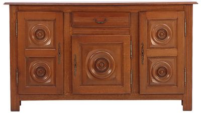 THREE DOOR FRENCH OAK SIDEBOARD HAVING CIRCULAR DESIGN IN THE MANNER OF CHARLES DUDOUYT C 1940. 
