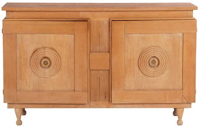 FRENCH OAK SERVER HAVING TWO DOORS AND CIRCULAR DESIGN IN THE MANNER OF CHARLES DUDOUYT C 1940. 