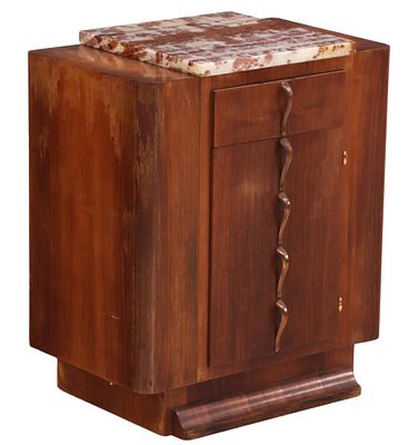 A FRENCH ART DECO MARBLE TOP SIDE CABINET HAVING ONE DRAWER OVER ONE DOOR BOTH WITH SCULPTURAL. A 