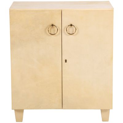 TWO DOOR PARCHMENT COVERED CABINET WITH BRASS HARDWARE C 1950 IN THE MANNER OF JEAN-MICHEL. Two 
