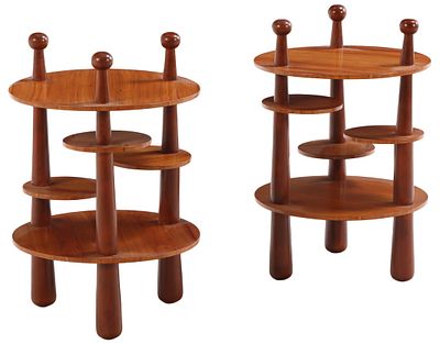 PAIR OF ROUND END TABLES HAVING BAT FORM LEGS AND SWING OUT DRINKS HOLDERS IN THE MANNER OF JEAN. 