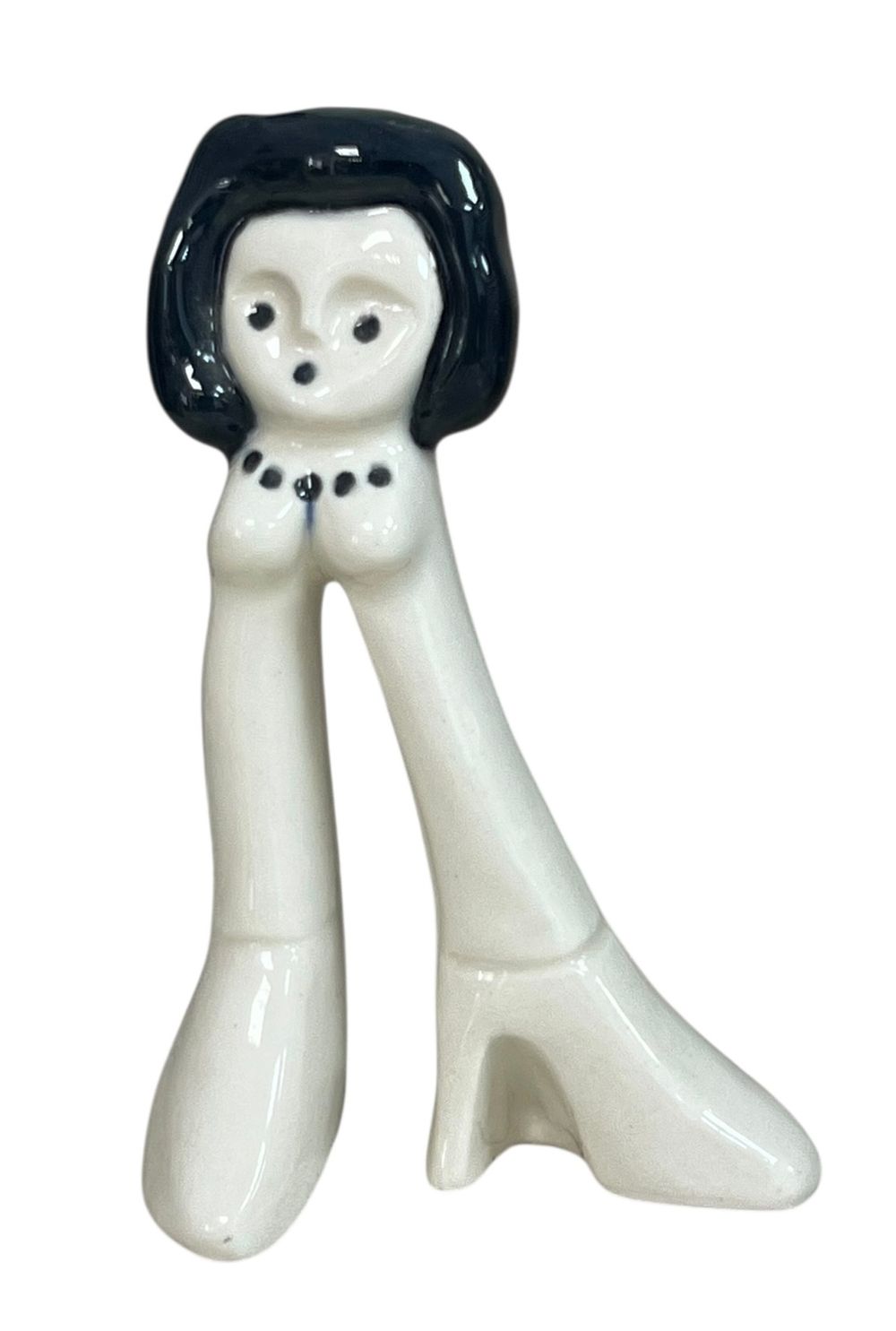 לפיד - TOPS 'n' TOES 
שנות ה-70. עיצוב דבי גזית. 
פיגורת אישה בעלת ראש ורגליים מוארכות ללא 