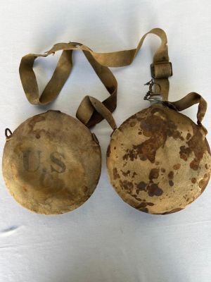 Two Indian Wars Era Canteens. 1 with canvas strap, 1 missing spout - Both show wear from use
