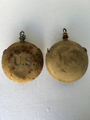 Two Indian Wars Era Canteens, 1 with ID. Two Indian war era canteens, one marked in old ink Co. 