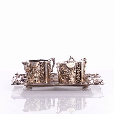 Three-Piece Sterling Silver Set with Peach Blossom Decor Hong Kong, Qing Dynasty, 19th century. 