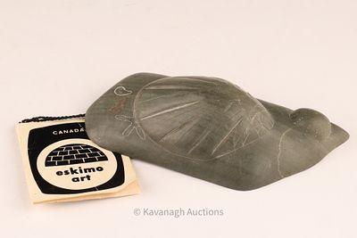 Inuit Soapstone sculpture Jimmy Kattuk Belcher Islands. A compact stylized carved object in 