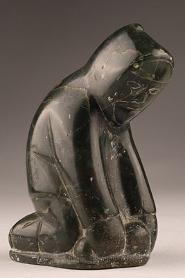 Inuit Soapstone Serpentine Carving, Kneeling Figure sculpture. A small Inuit carving of a 