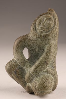 Inuit Soapstone Carving of a Seated Figure, by Muna Parr, Cape Dorset. Carved from mottled 