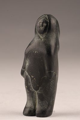 Small Inuit Stone Carving of Standing Woman. A hand-carved Inuit stone figure of a standing 