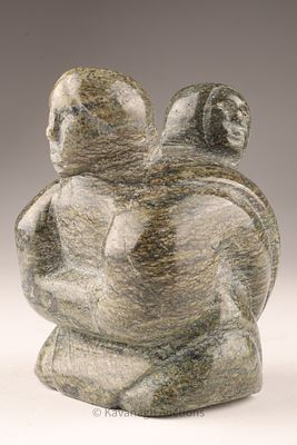 Inuit Stone Carving of a Seated Figure by A. Kopainuk (Repulse Bay). A finely carved Inuit stone 