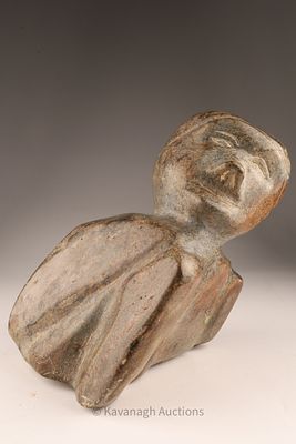 Large Inuit Stone Sculpture of a Seated Figure. A substantial Inuit stone carving depicting a 