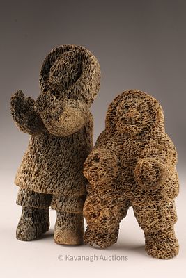 Inuit Carving of Two Figures in Fossilized Bone. A unique single-piece Inuit carving, fashioned 