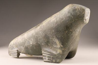 Inuit Stone Carving of a Walrus. A finely carved Inuit stone sculpture of a walrus, shown in a 