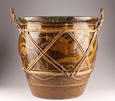Large Chinese Brown and Green Glaze Jardiniere Egg Pot with woven carrying cord and decorated 