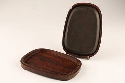 A Chinese Calligraphy Inkstone in Hardwood Box. Chinese calligraphy inkstone in carved wooden 