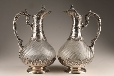 Antique French silver-mounted crystal glass claret jugs from Paris, circa 1880. The set features 
