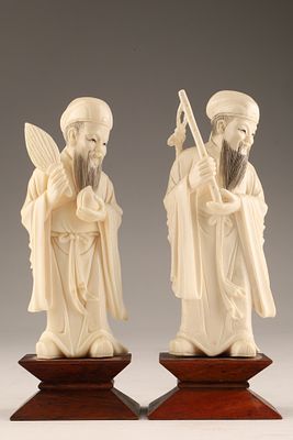 Pair of Chinese Carved Scholar Figures on Hardwood Bases. Pair of finely carved Chinese scholar 