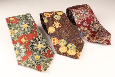 A Set of 3 Chanel Mens Silk Ties, Made in Italy. Set of 3 composed of one red base with large 