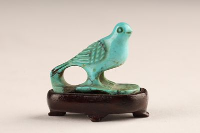 Chinese Miniature Carved Turquoise Bird Figurine on Wooden Stand. A finely hand-carved natural 