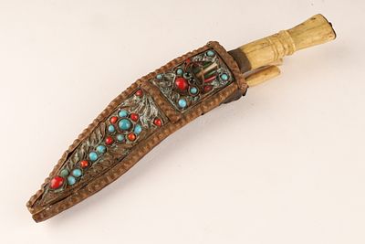 Antique Tibetan Kukri Knife in Leather Jewelled Scabbard. An antique Tibetan kukri knife and two 