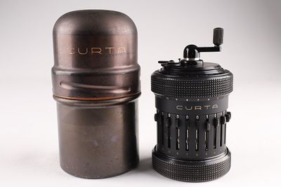 Mid Century Curta Mechanical Calculator in Original Storage Container. A mid century 1955 Curta 
