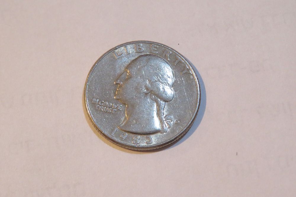 מטבע רבע דולר ארה"ב מידו הקדושה של הרבי. 
מטבע בערך נקוב על סך רבע דולר (קוורטר) ארה"ב, שניתן 