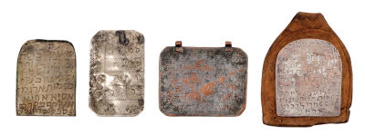 Four Amulets – Morocco / Amulet in Original Leather Pouch. Four amulets. Morocco, [early 20th 