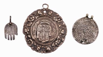 Three Amulet Pendants – Palestine and Near East. The description and condition report appear 