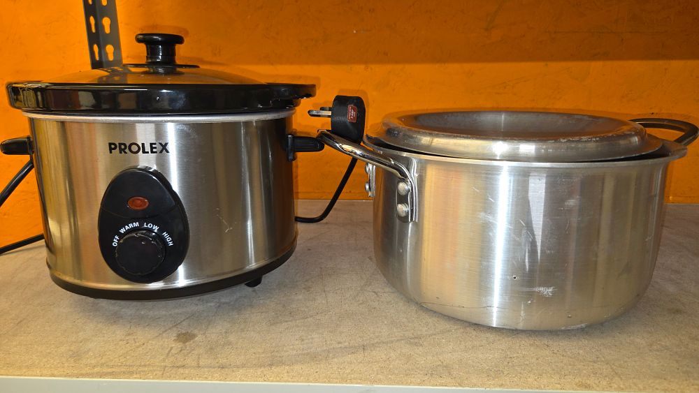 Lot 304 – Two silver coloured kitchen items including a Prolex slow cooker w/o