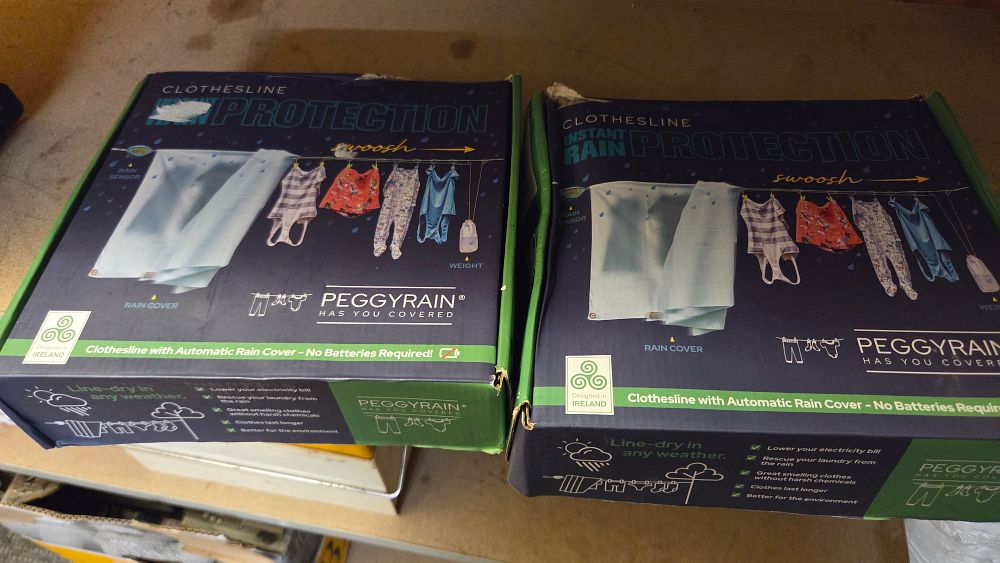 Lot 316 – A Pair of PeggyRain Automatic Rain Protection Clothesline Systems