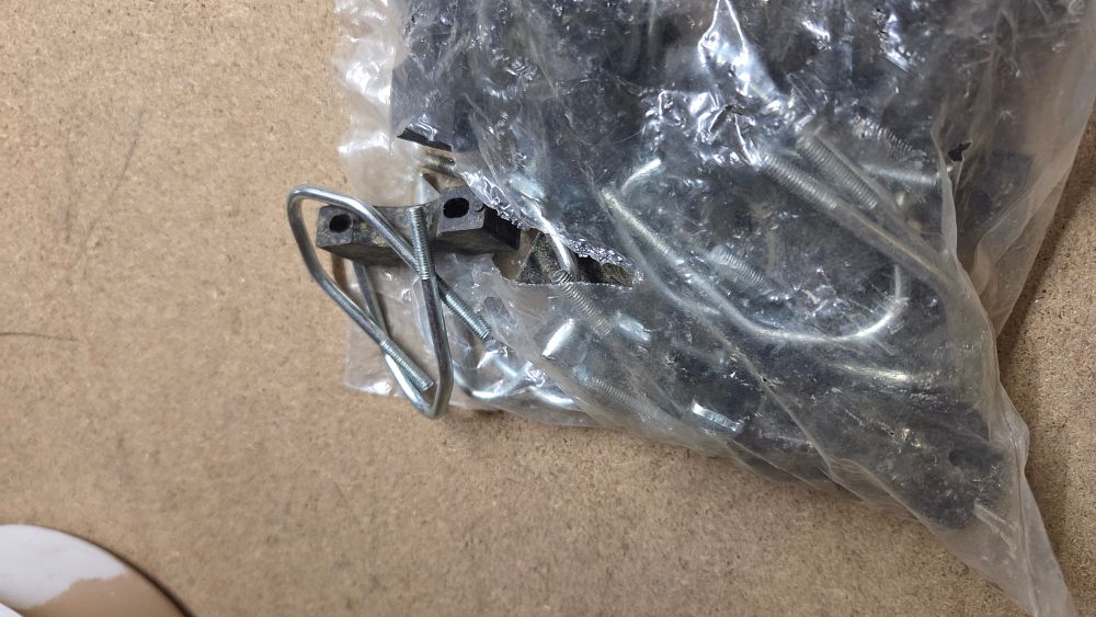 Lot 340 – A Collection of Metal U-bolts and Plastic Mounting Brackets