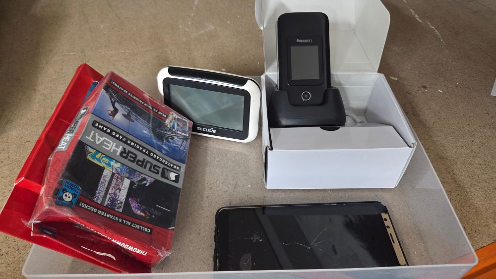 Lot 358 – A Collection of Electronics and a Skateboard Trading Card Game