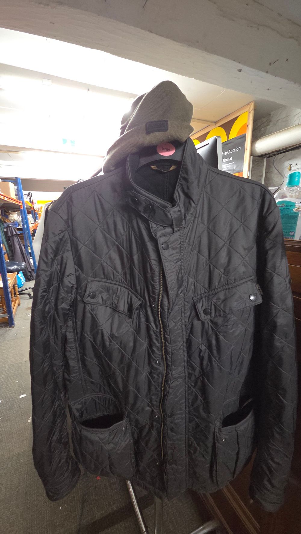 Lot 385 – Barbour black quilted jacket and olive green Barbour beanie hat