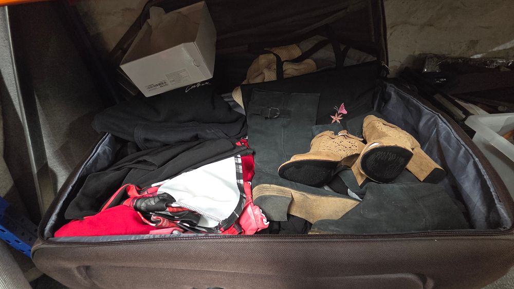 Lot 388 – A Suitcase of Assorted Clothing and Footwear