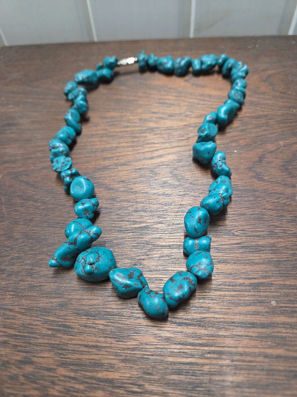 Lot 603 – Turquoise Coloured Nugget Bead Necklace with Silver Toned Clasp