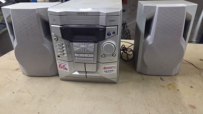 Sharp CD-E250 Mini Component System with Two Speakers. A silver Sharp CD-E250 mini component 