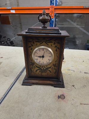 Vintage Floral Painted Wooden Quartz Mantel Clock. A dark brown wooden mantel clock featuring a 