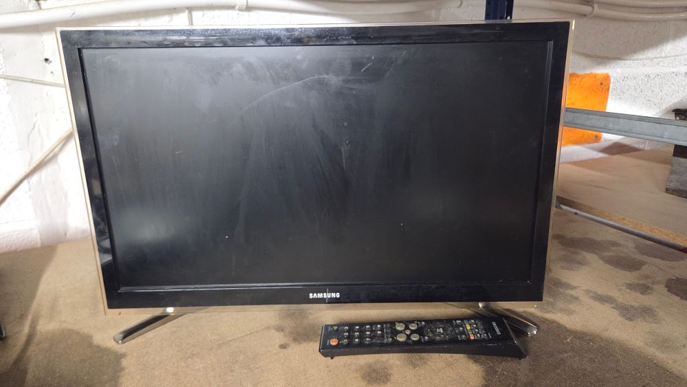 Lot 213 – Samsung television and remote control