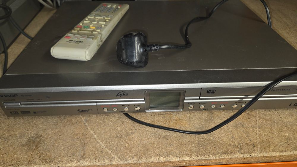 Lot 272 – Sharp DV-HR480 Recorder and Remote Control powers on