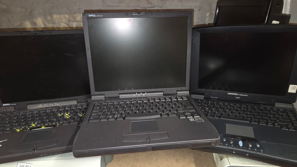 Lot 460 – Several Dell Latitude and Compaq Presario 1200 Laptops