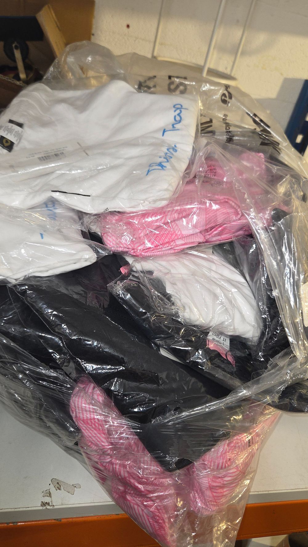 Lot 158 – A Collection of New Clothing. Including Saw It First and Thirst Trap Garments